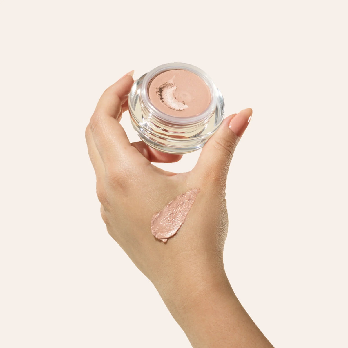 Under Eye Brightening Cream product shade Fair model hand.